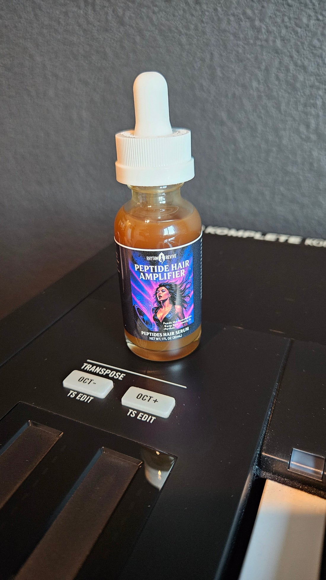 peptide Hair Amplifier sitting on top of a Komplete S88 Native instruments MIDI controller