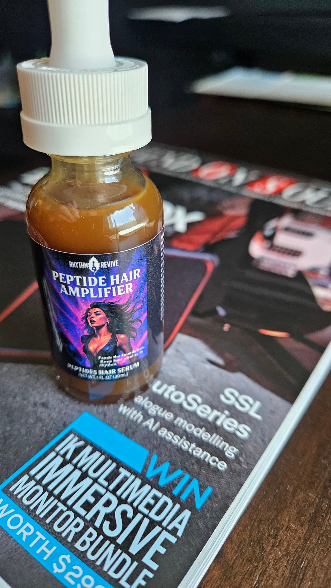 Peptide Hair Amplifier on top of a Sound on Sound magazine