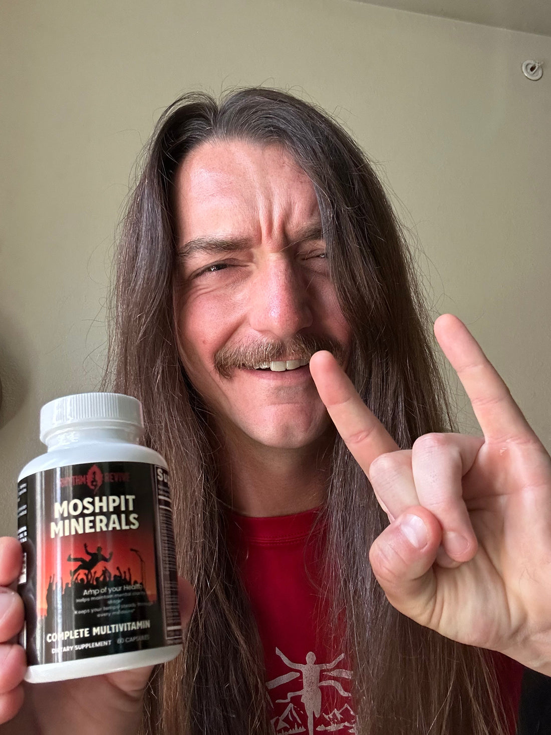 Innerstate lead singer Dalton holding a bottle of Moshpit Minerals