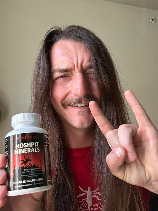 Innerstate lead singer Dalton holding a bottle of Moshpit Minerals