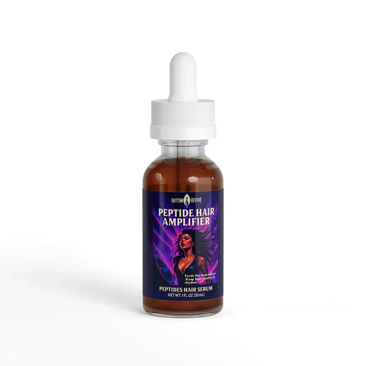 Brown glass dropper bottle labeled "PEPTIDE HAIR AMPLIFIER" from Rhythm & Revive, featuring a stylized illustration of a woman with flowing purple and pink hair; white dropper cap and bold product text emphasize its role as a peptide-based hair serum.