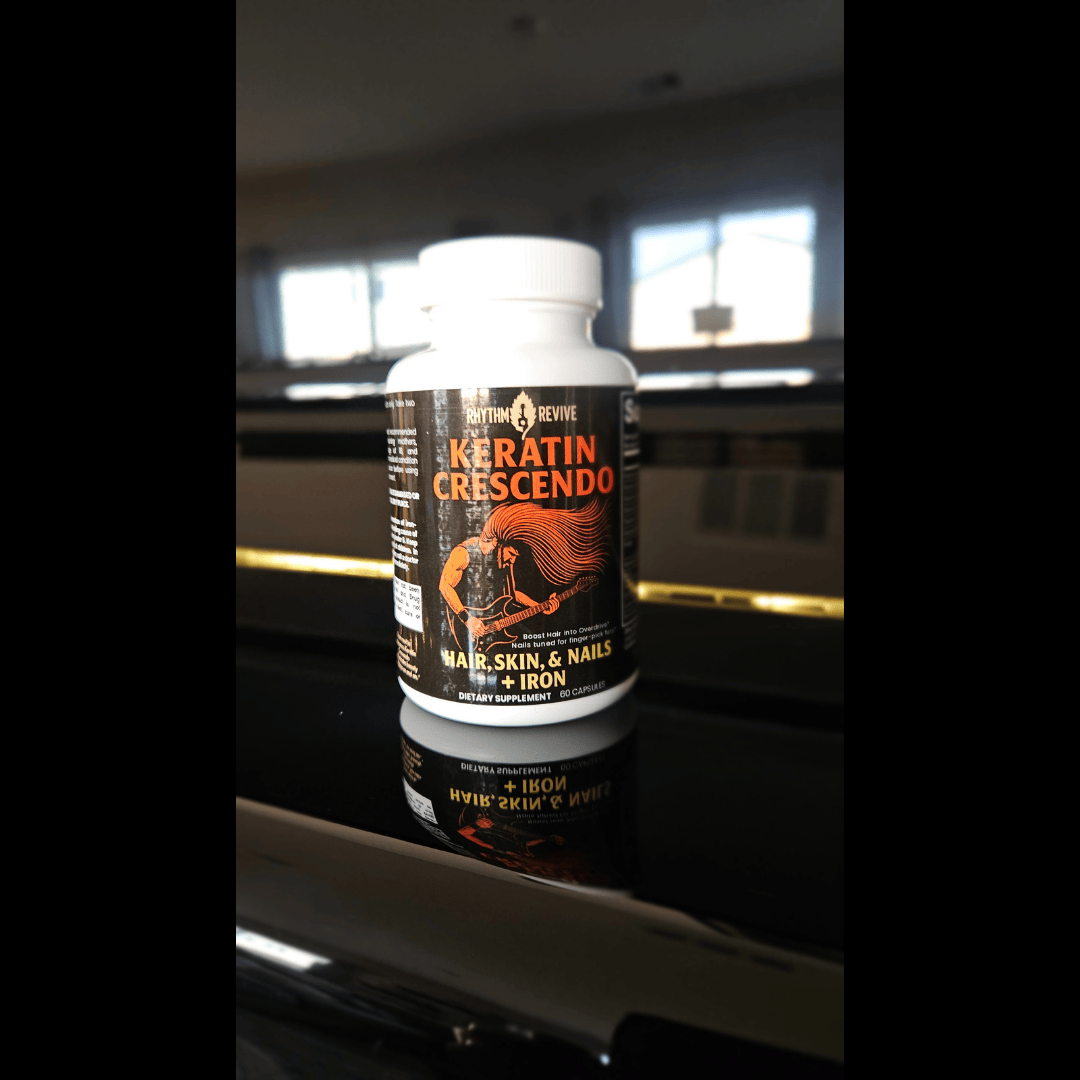 Keratin Crescendo supplement bottle on a reflective surface with a blurred indoor background