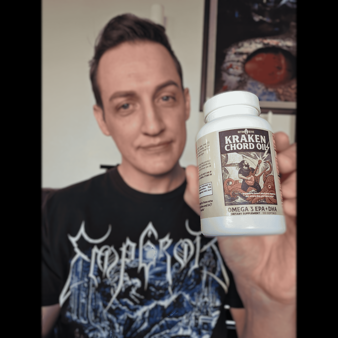 Person holding a bottle of 'Kraken Chord Oil' in front of a neutral background