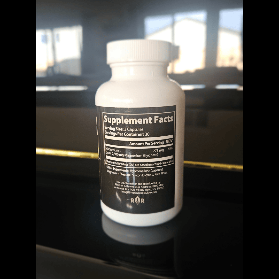 Supplement bottle with label on a reflective surface